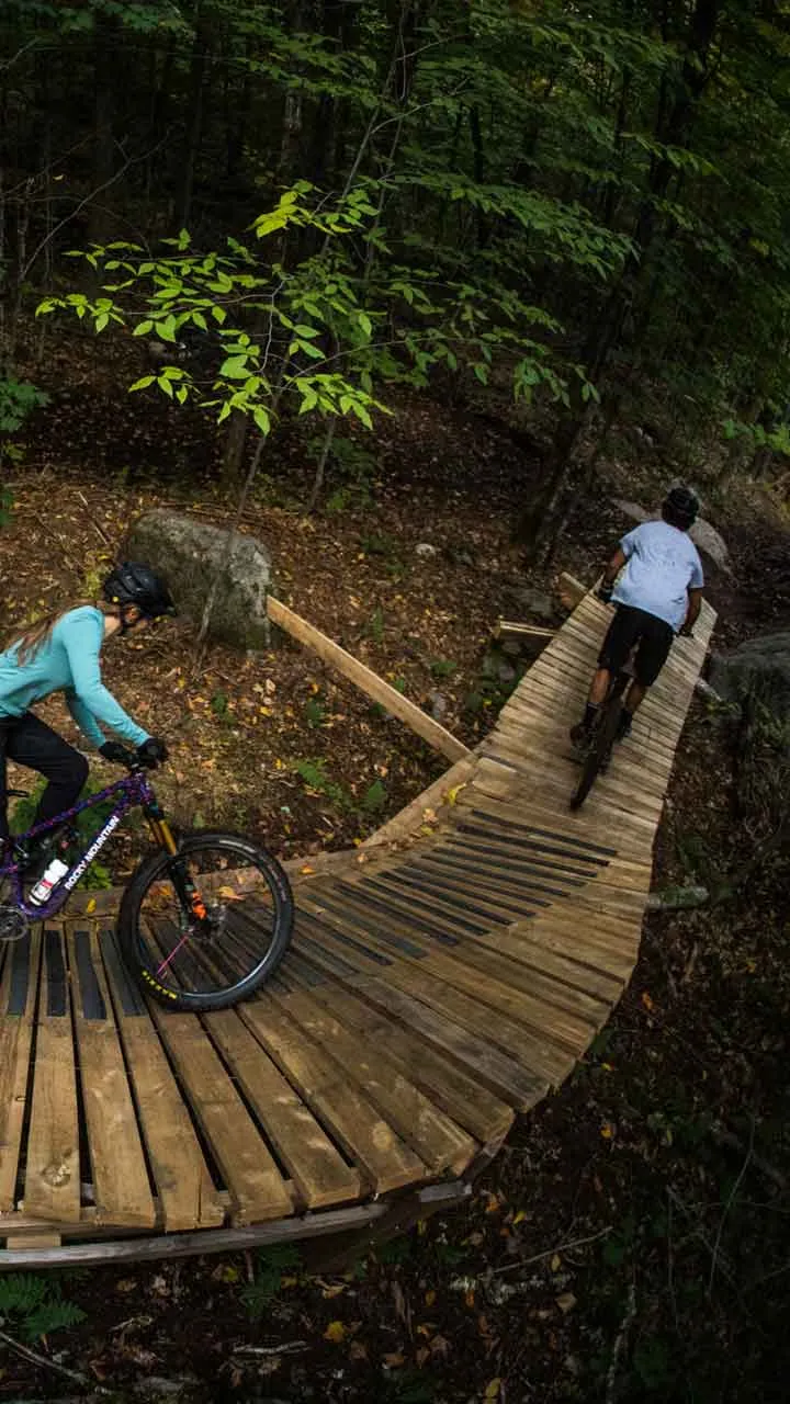 Bikers riding on boardwalk