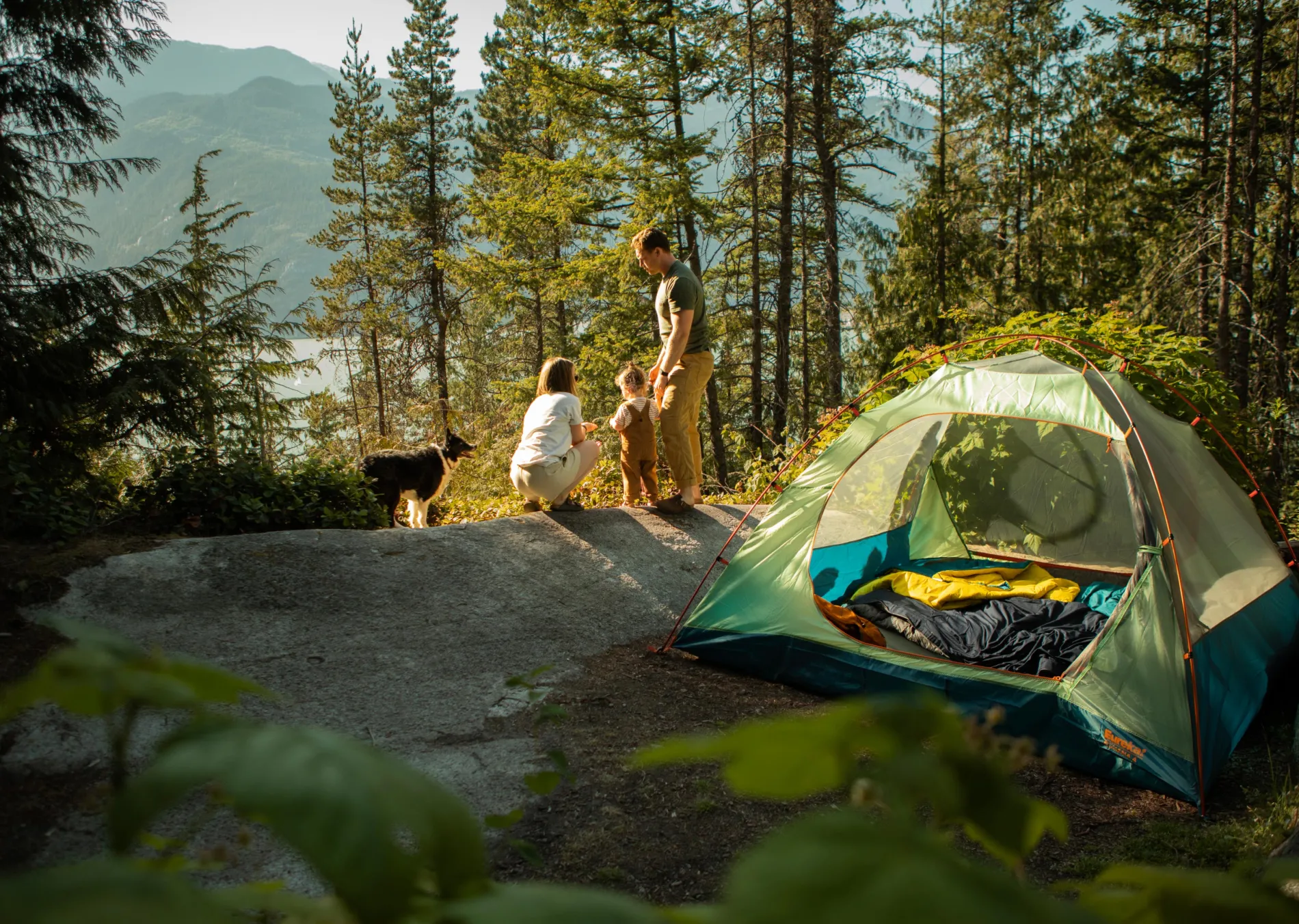 Family tent camping with a view of the ocean